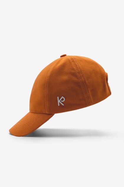 An orange Baseball Cap from the side